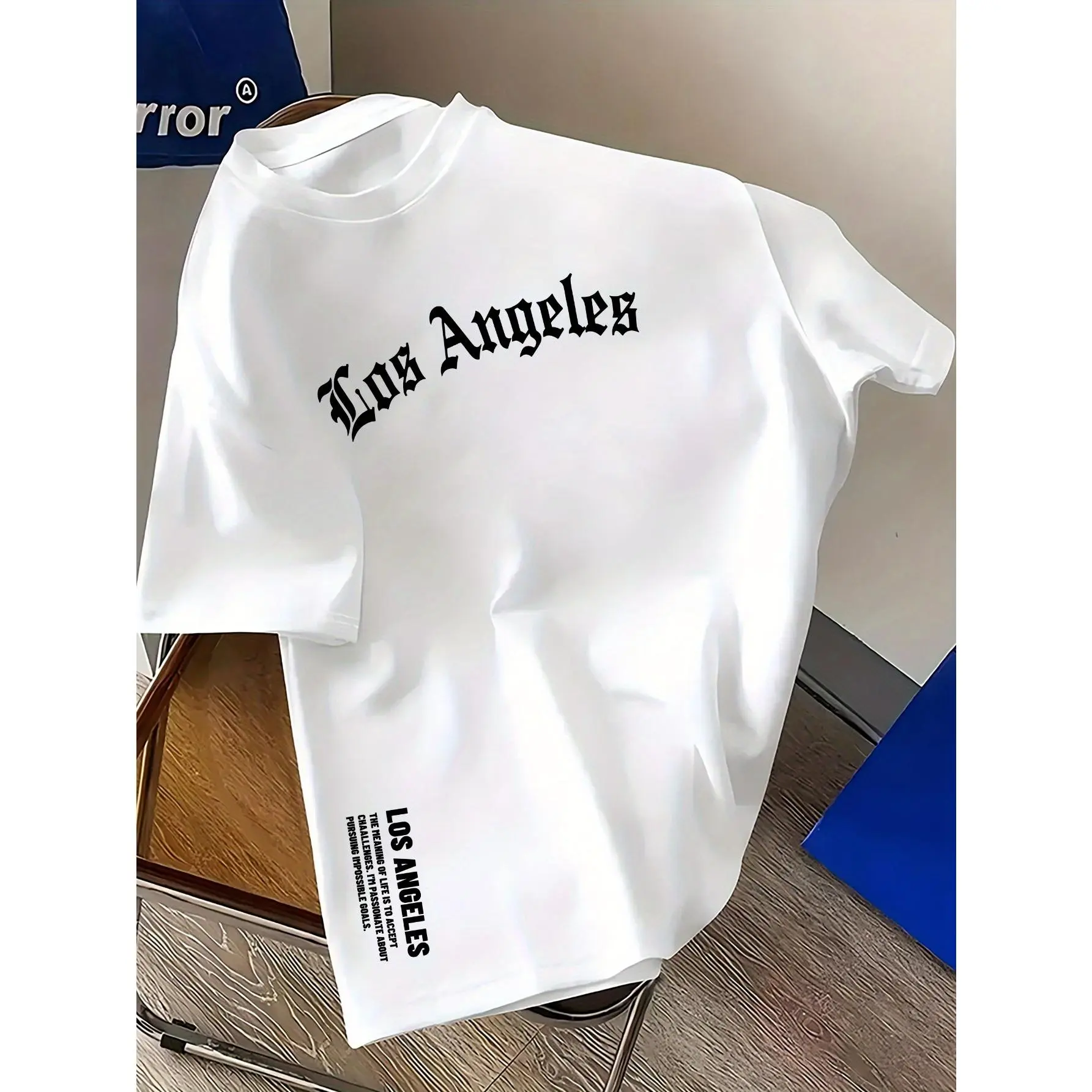 A casual polyester t-shirt for men with geometric Los Angeles prints, round neck design, elastic fabric, regular summer styling