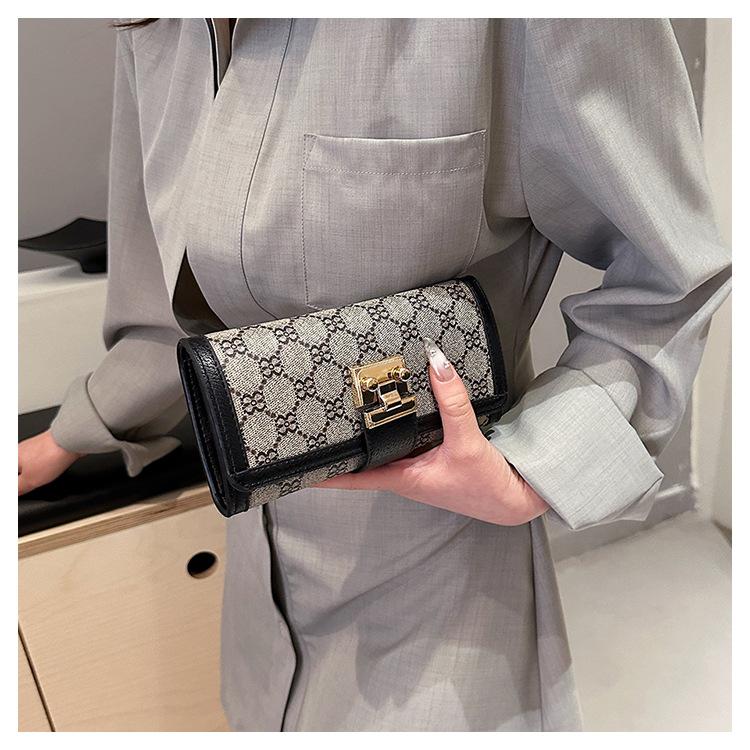 Product Introduction of Ladies' Short, High Appearance, Multi Slot, Three Fold Buckle, Hand-held Long Wallet 24