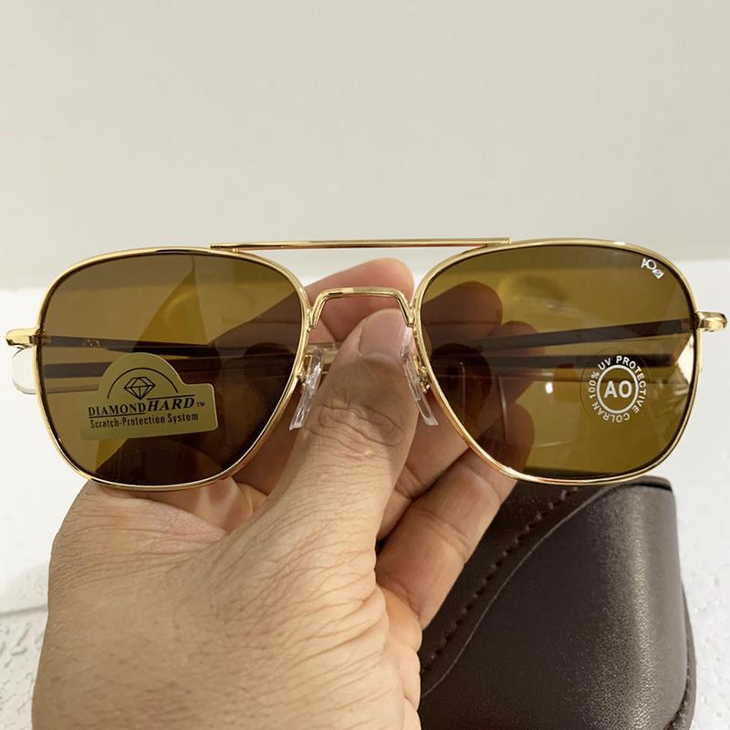 Kính mắt AO Pilot USA, dáng phi công tròng màu nâu chất liệu thủy tinh cường lực chống xước, dành cho nam  ống kính đen / cam đủ viền Tròng Kính Voi Cao Su Caro