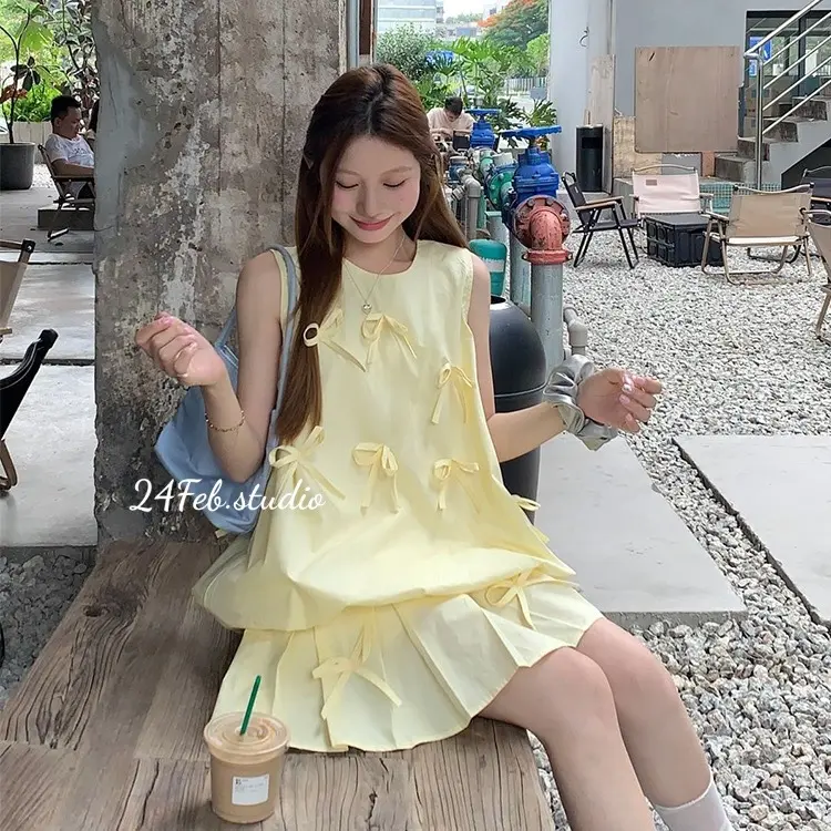 [SET55] Set áo ba lỗ kèm chân váy xếp li dáng ngắn đính nơ phong cách tiểu thư Hàn Quốc 2