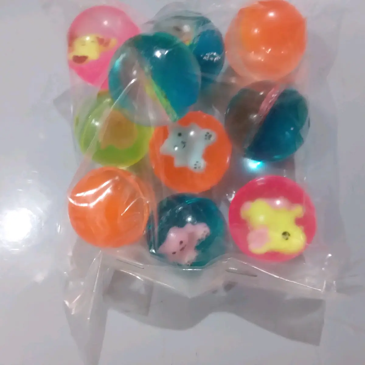 Mainan bola bekel 27 mm motif boneka isi 10 pcs,Bola bekel motif boneka ukuran 27 mm  random,10 pcs bola bekel 27 mm motif boneka random