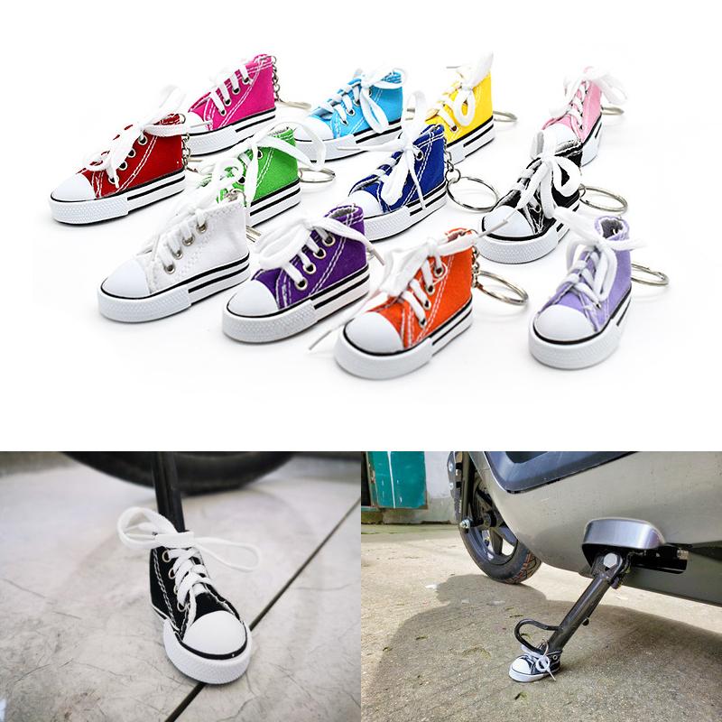 Product Introduction of Motorcycle Bicycle Foot Support Mini Cute Shoes Creative Car Keychains for Motorbike Bike Tripod Canvas Shoes Decor Cover 1