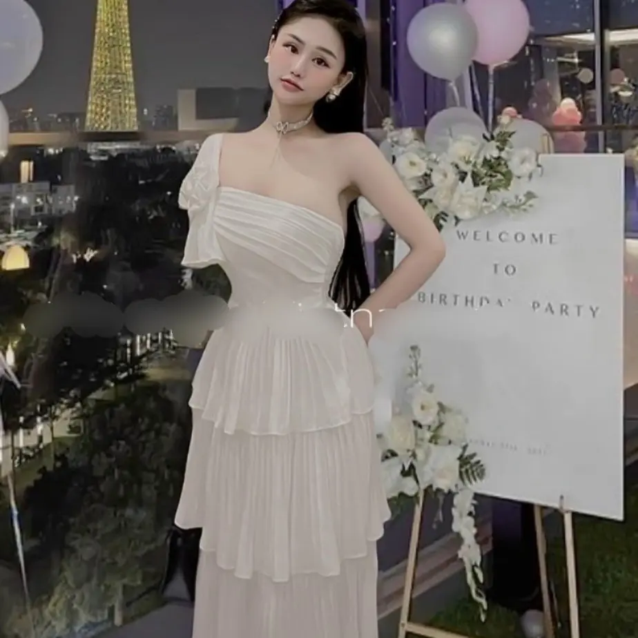 ĐẦM LỆCH VAI CÓ NƠ XẾP TẦNG ( eo dưới 76cm)