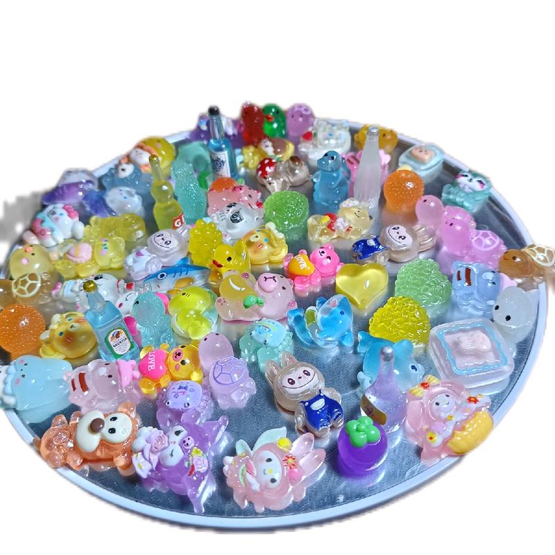  Sét 100 túi mù charm mini phát sáng tự xé dễ thương 