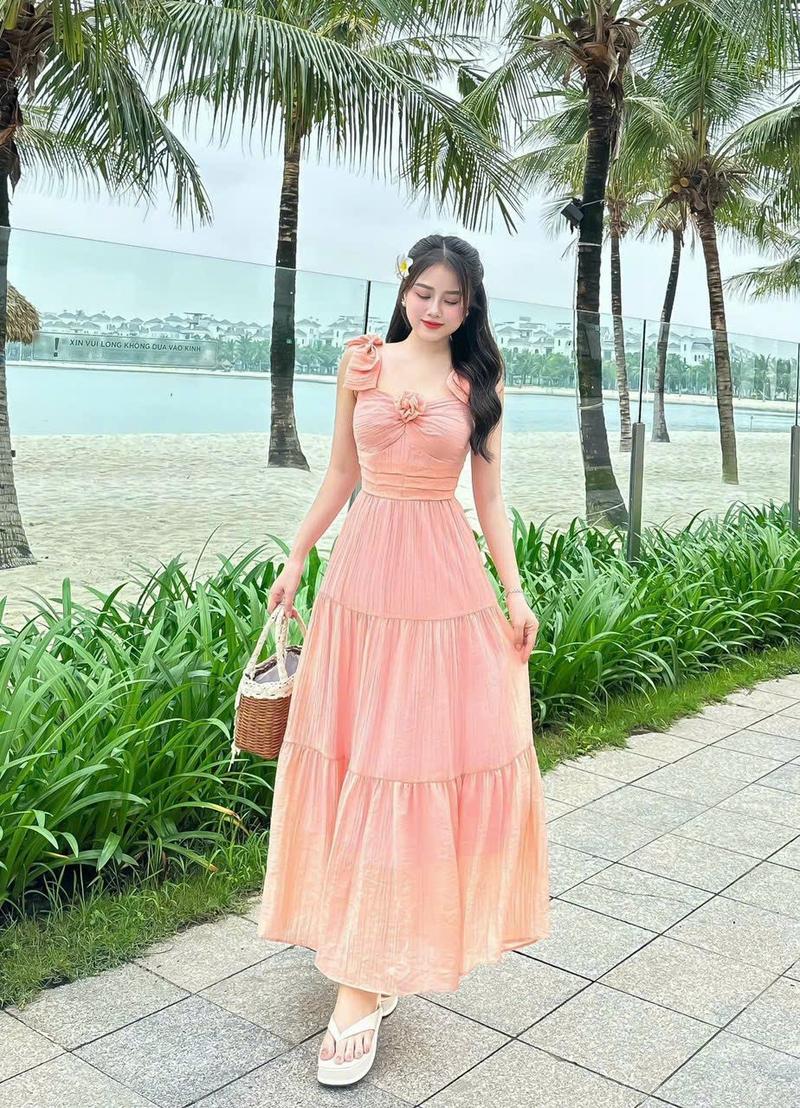 Product Introduction of Đầm maxi thời trang nữ mặc đi biển chất tăm gãy vai nơ ngực gắn bông váy dài xòe maxi có lót trong có 5 màu như hình qc Màu Hồng 4