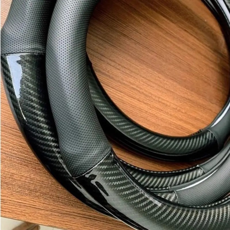 Bọc vô lăng CARBON phối da thoáng khí đủ các hãng xe Toyota-Honda-Hyundai-Mazda-KiA-Ford-Mitshubishi-Chevrolet cao cấp Cacbon 4