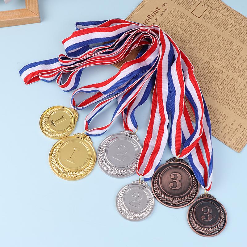 Premium Vector | A Set Of Four Gold, Silver, And Bronze Award Medals