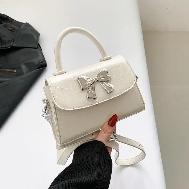 Túi xách nữ cầm tay đeo chéo da trơn Đính Nơ Bạc xinh xắn Bag 1