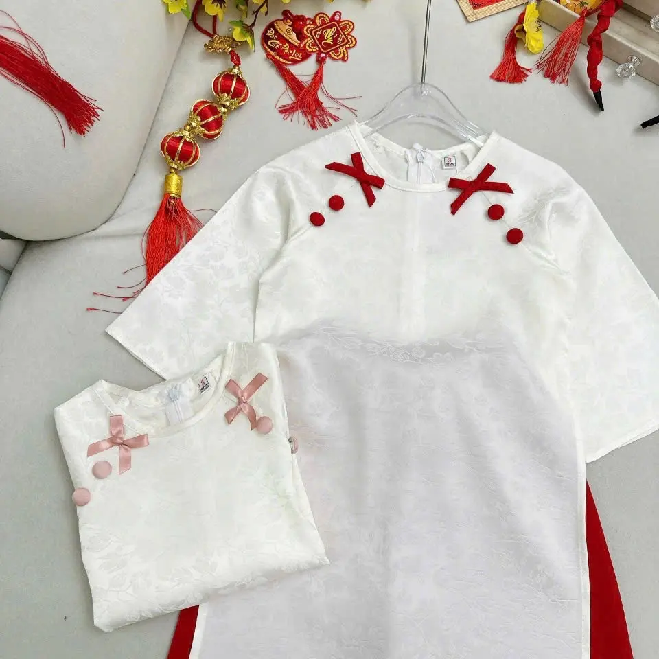 Áo dài cách tân bé gái.  Xưởng sản xuất áo dài trẻ em,chuyên nhận  đặt hàng may gia công cho các shop theo mẫu với số lượng lớn .xưởng có  bán sỉ ,bán lẻ.