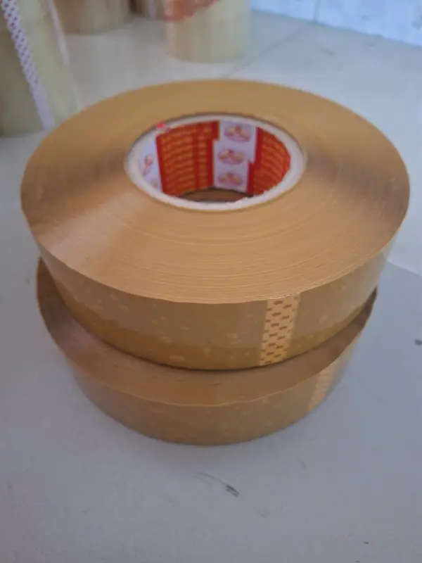 Băng keo ĐỤC siêu dính loai  1 kg/ cuộn  trong ( 1 cuộn= 1kg), chuyên dán thùng hàng nặng, thùng hàng xuất khẩu 1