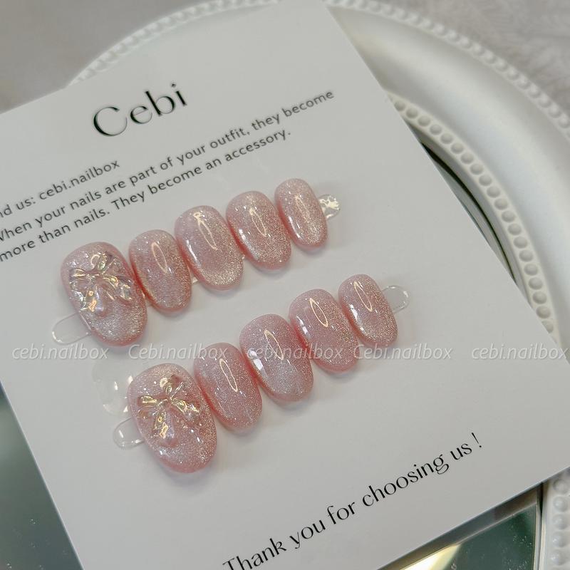 Móng úp thiết kế C957 dáng ngắn thạch hồng mắt mèo đính nơ hologram dễ thương