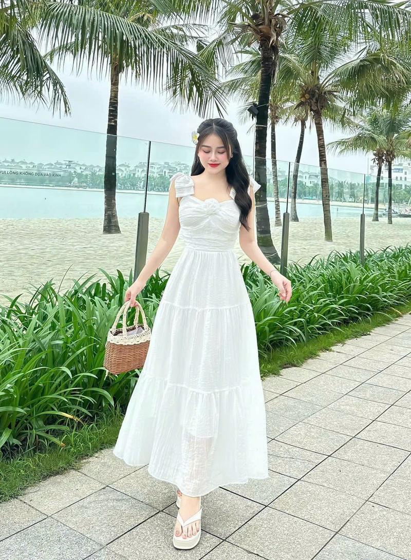 Product Introduction of Đầm maxi thời trang nữ mặc đi biển chất tăm gãy vai nơ ngực gắn bông váy dài xòe maxi có lót trong có 5 màu như hình qc Màu Hồng 5