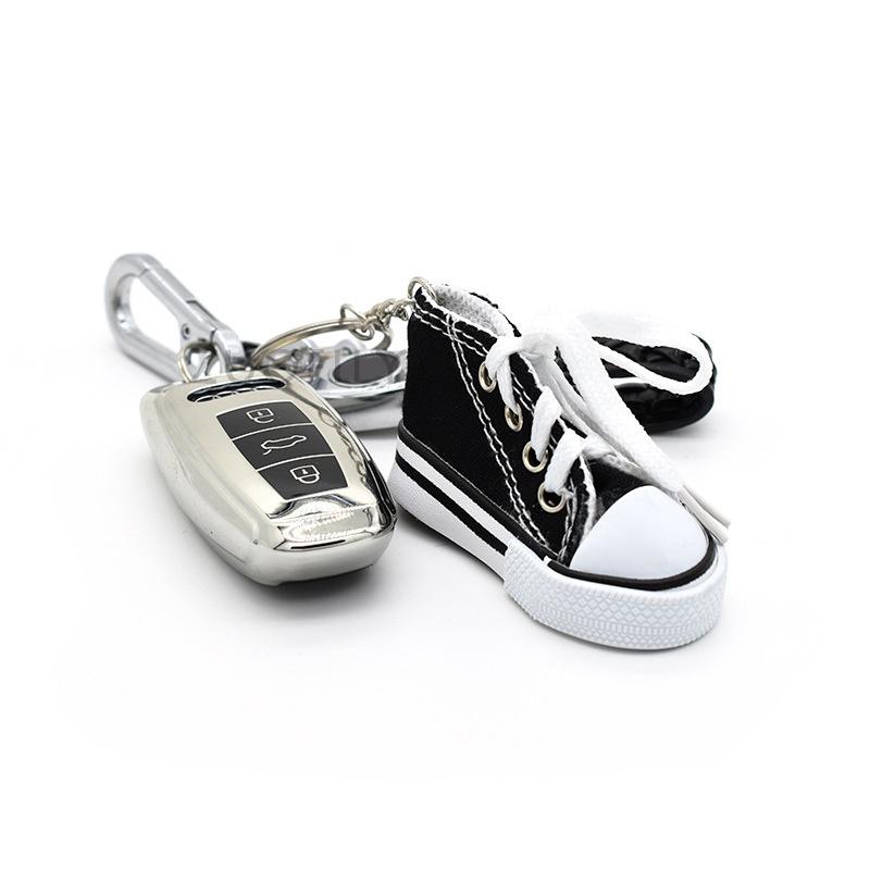 Product Introduction of Motorcycle Bicycle Foot Support Mini Cute Shoes Creative Car Keychains for Motorbike Bike Tripod Canvas Shoes Decor Cover 4
