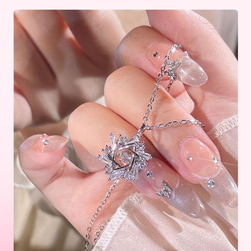 Product Introduction of Silver Titanium Steel Cross Chain Necklace with Winter Beating Heart Snowflake Pendant for Women Sweet Light Luxury Clavicle Chain 8