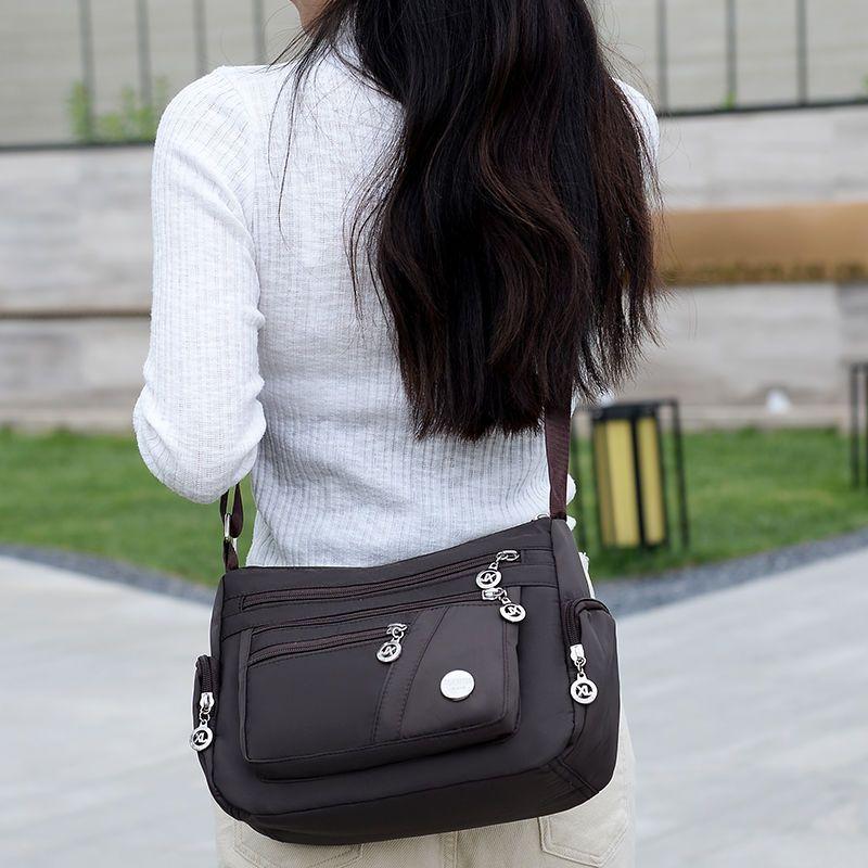 Product Introduction of Women's Bag Mother's Bag New 2025 Middle-Aged Women's Bag Nylon Canvas Bag Waterproof Multi-Layer Shoulder Messenger Bag 12