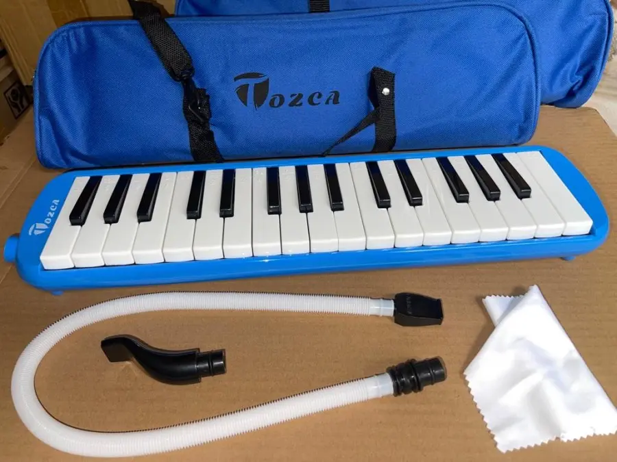 PIANIKA TOZCA ADA TULISAN DOREMI TAS