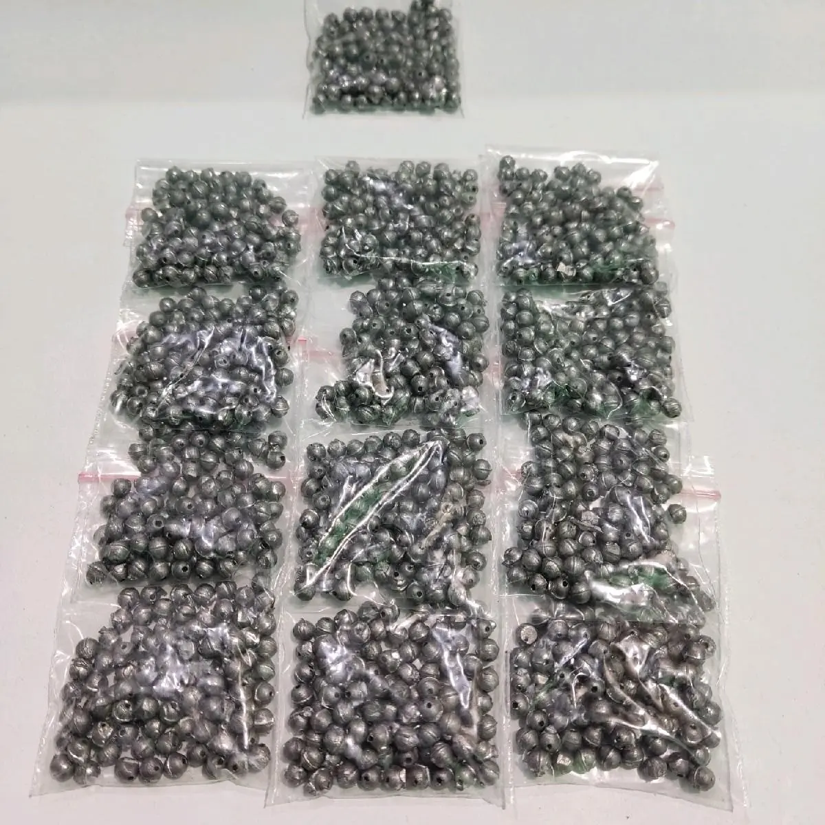 timah pasir no. 00 perbungkus isi kurang lebih 100pcs berat 50 gram