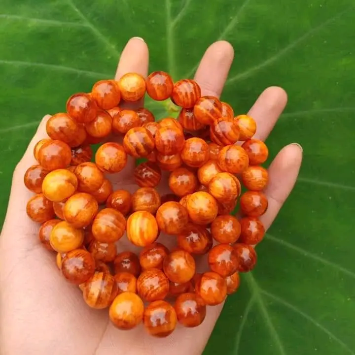 VÒNG TAY GỖ HUYẾT LONG THẤU QUANG 4