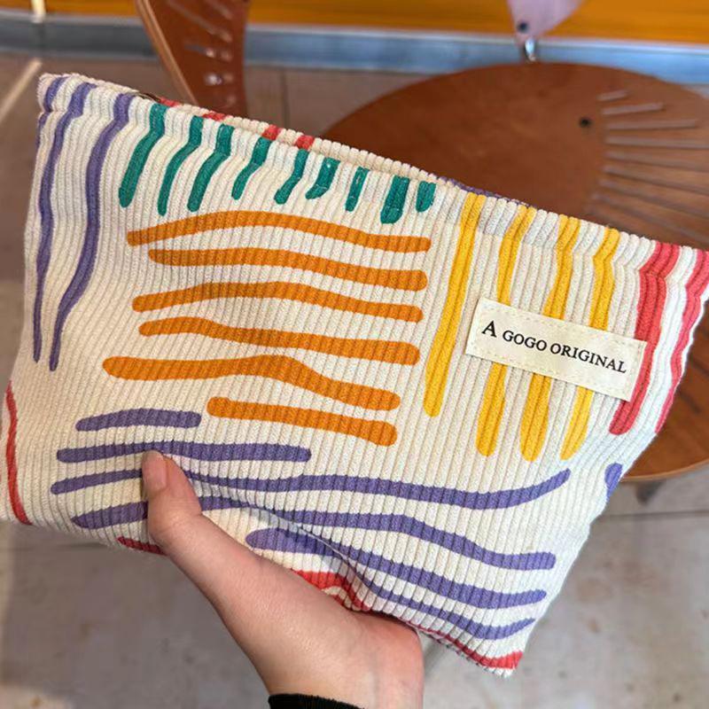 Product Introduction of Korduroi cosmetic bag with colorful stripes, portable travel toiletry bag, skin care, various items, aesthetic makeup storage bag 13