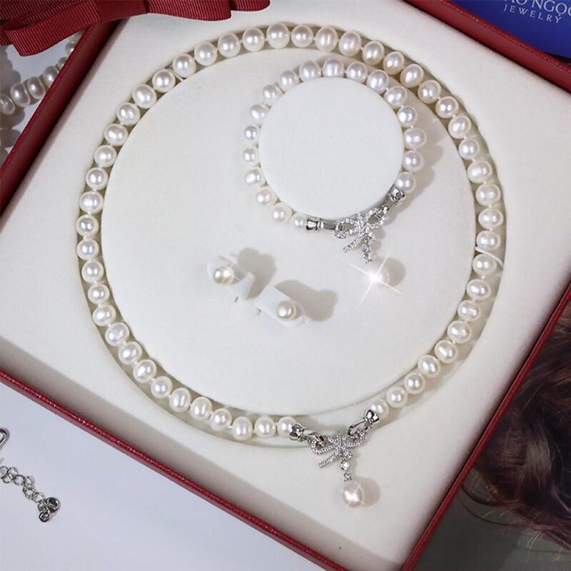 Bộ Trang Sức Ngọc Trai Khóa Nơ Trắng 8ly Sang Trọng Gồm Dây Chuyền, Vòng Tay, Bông Tai - Ngọc Trai Trường Thịnh