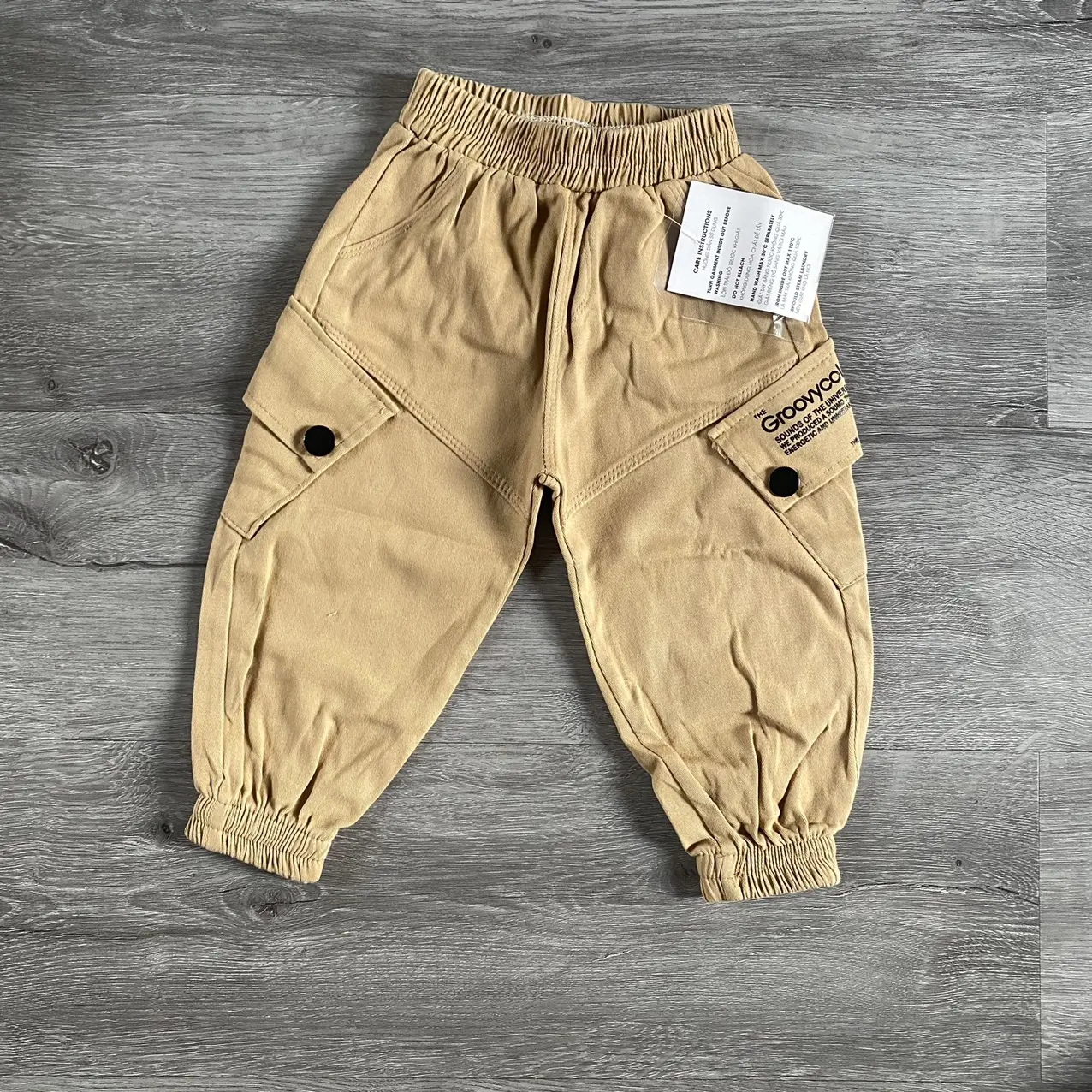 Quần kaki túi in chữ ống bo chun cho bé trai size 8-20kg