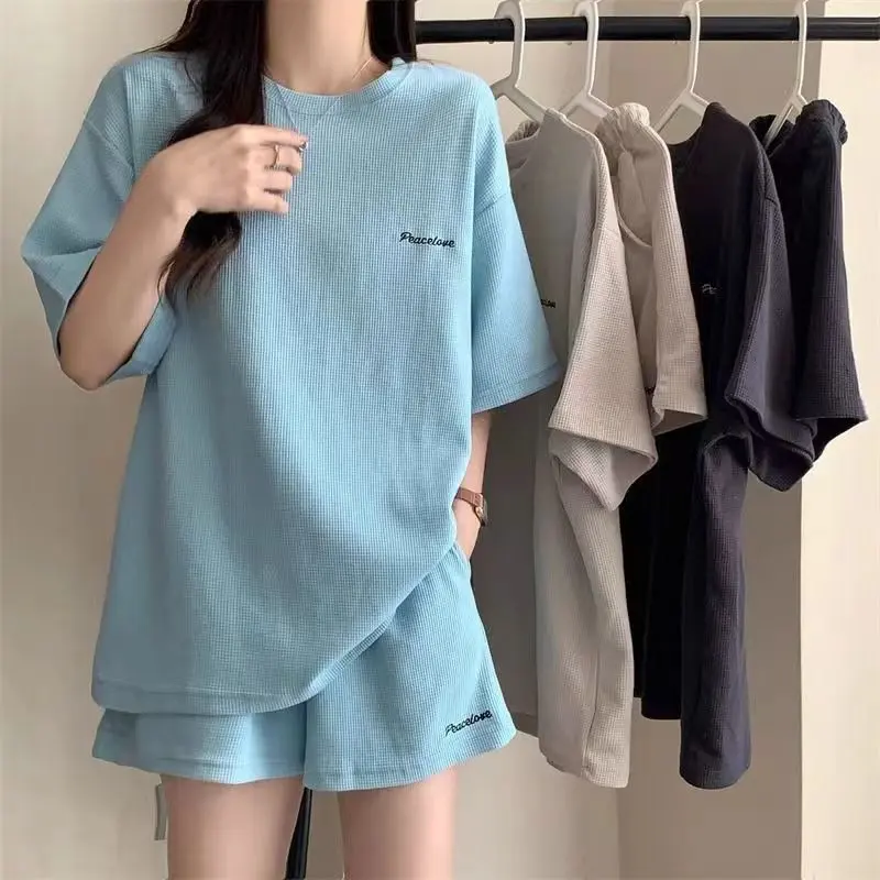 Cross border Korean style fashionable sports and leisure suit for women, loose fit, summer slimming two-piece set, short sleeved shorts, trendy