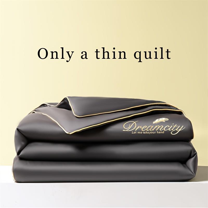 Product Introduction of 1 Piece Dreamy Summer Light Quilt - Soft, Light Beige Friendly 100% Microfiber, Designed with Gold Leaves and "DREAMCITY" Words, Gray with Gold Accents, Machine Washable, Pillowcase and Bed Sheet Not Included, Summer Bedding | Fantasy-themed Decoration | 0