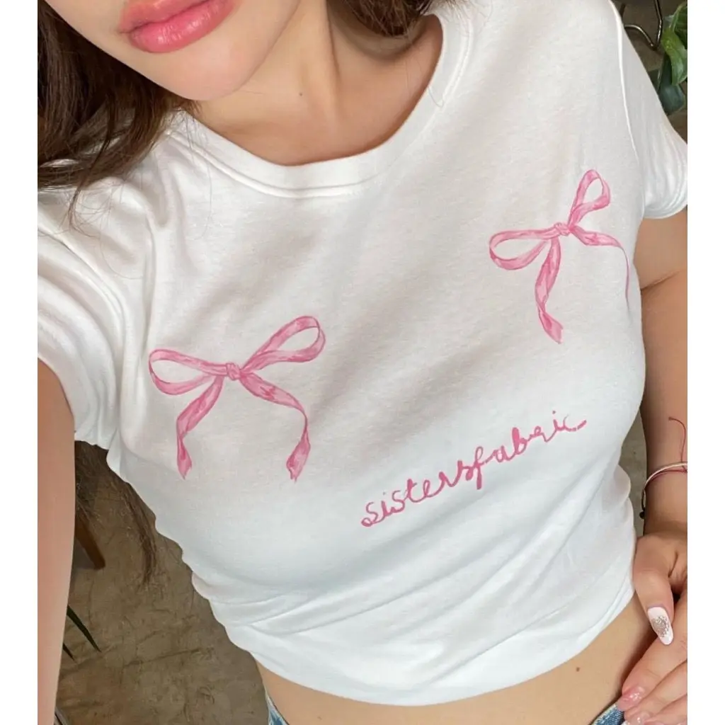 Áo BBT cổ tròn in nơ hồng chất liệu cotton thoáng mát kiểu dáng trẻ trung năng động