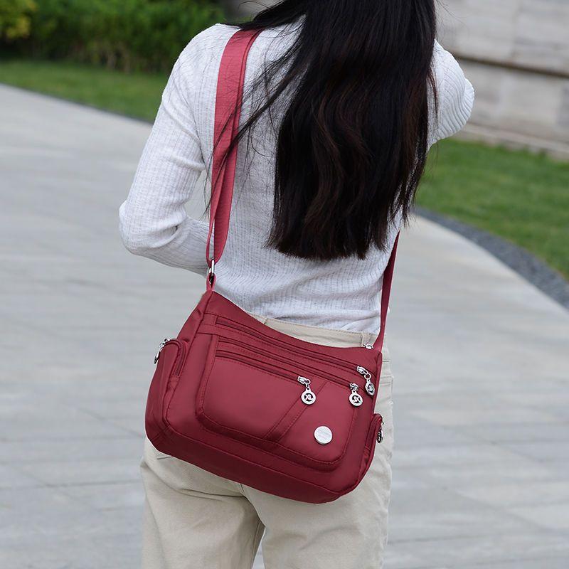 Product Introduction of Women's Bag Mother's Bag New 2025 Middle-Aged Women's Bag Nylon Canvas Bag Waterproof Multi-Layer Shoulder Messenger Bag 11