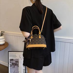 Women's Fashion Crossbody Bag Handbag, a Shell-Shaped Bag with Printed Design, Ribbon Decoration, and Long Crossbody Strap, Suitable for Daily Use and Matching Women's Bag