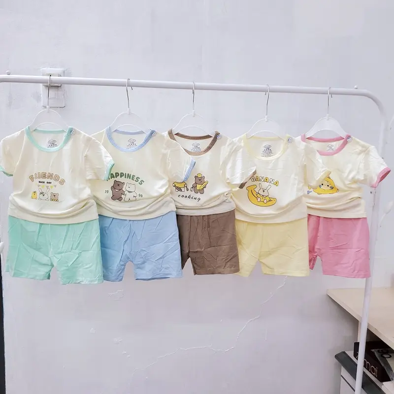 Unchi Bộ quần áo cộc tay mùa hè trẻ em cổ tròn chui đầu cúc vai in họa tiết vải thun lạnh mềm mát cho bé 6-13kg 0