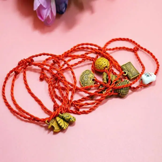 Hand-woven bell-shaped wood peachwood red rope zodiac year bracelet is selling well.Good luck red bracelet