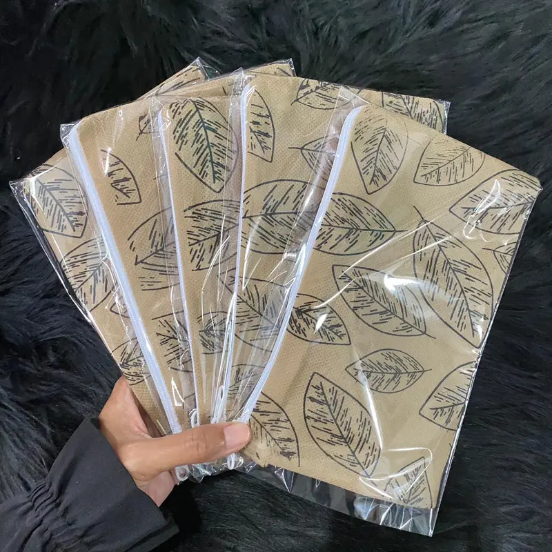 ( Isi 50 Biji ) Souvenir Dompet Bahan Spunbond Motif Harga Grosir 1