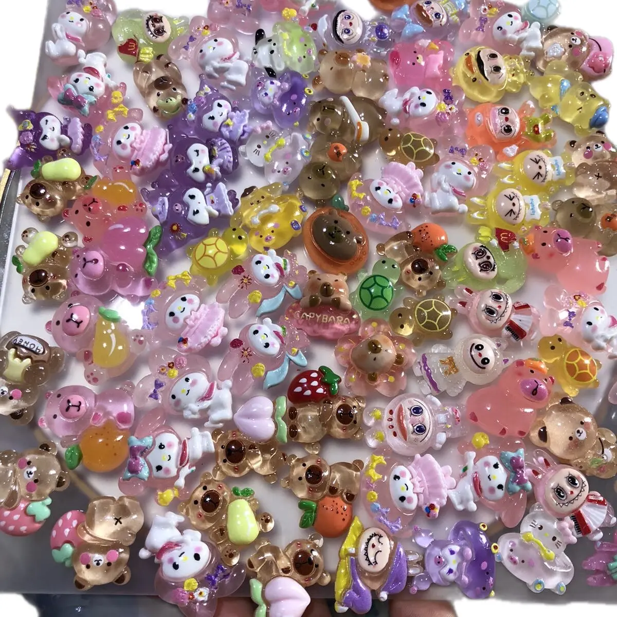 Sét 100 túi mù mi ni 2,5cm Charm phát sáng lộn xộn nhiều mẫu