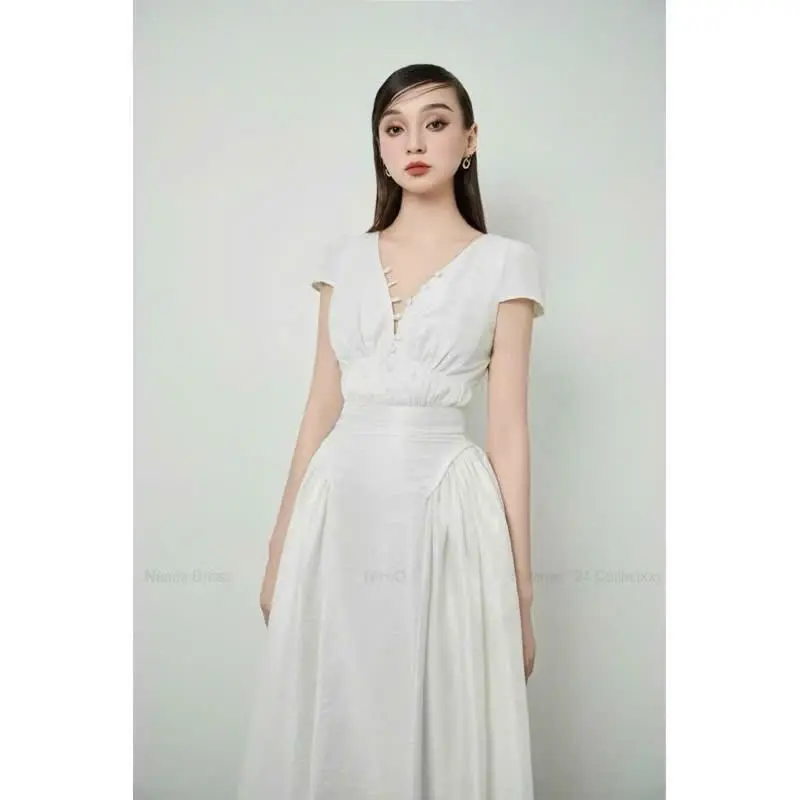 Váy trắng cổ V cúc học dúm eo tay ngắn bồng dáng xòe midi chất mềm nhẹ nhàng tiểu thư