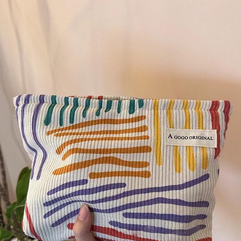 Product Introduction of Korduroi cosmetic bag with colorful stripes, portable travel toiletry bag, skin care, various items, aesthetic makeup storage bag 14