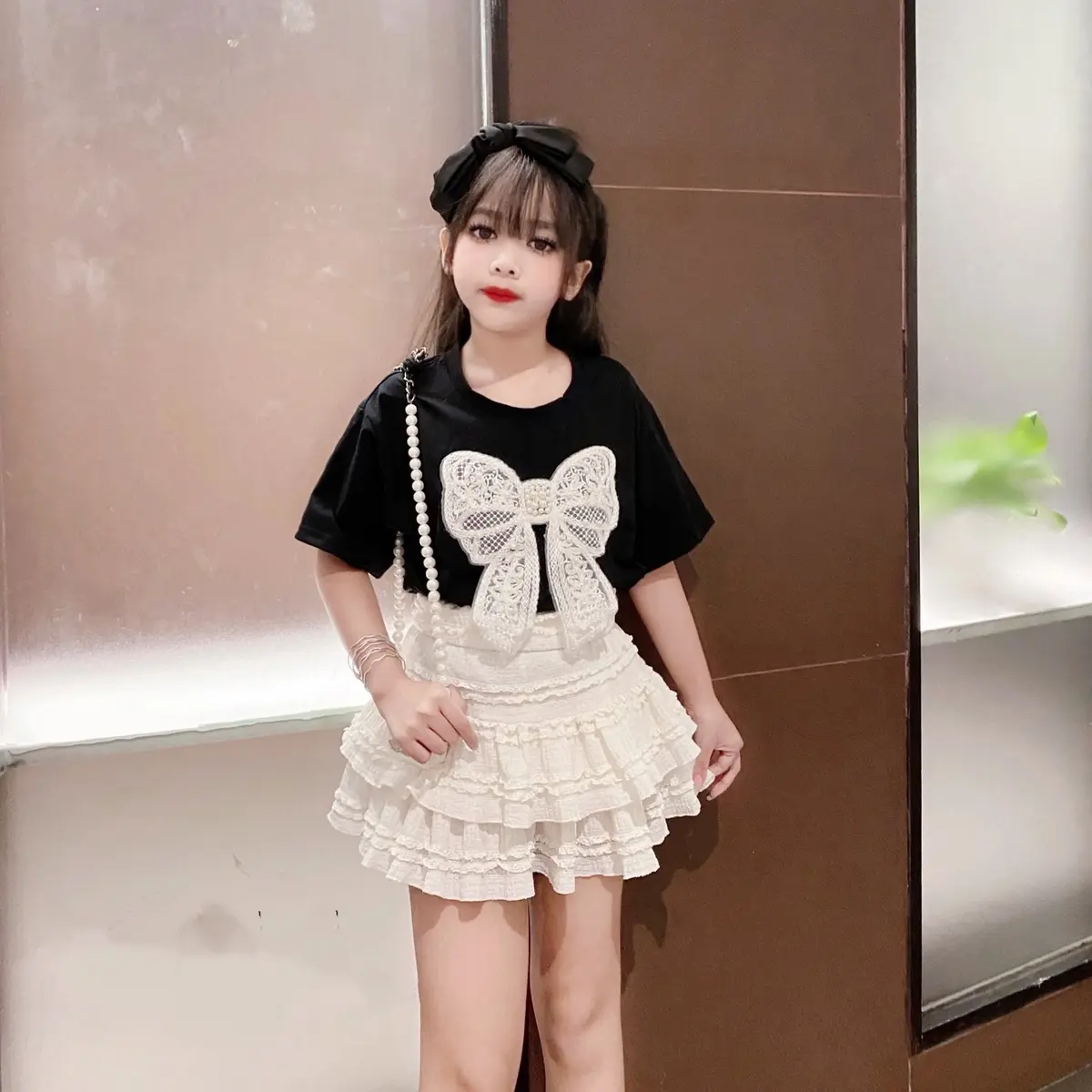 ￼Set áo  phối nơ ngọc + váy tầng ren Tiểu Thư  cho bé sz 17-42kg