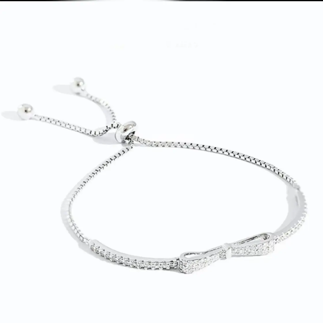 Lắc bạc nơ đá rút Sol Silver