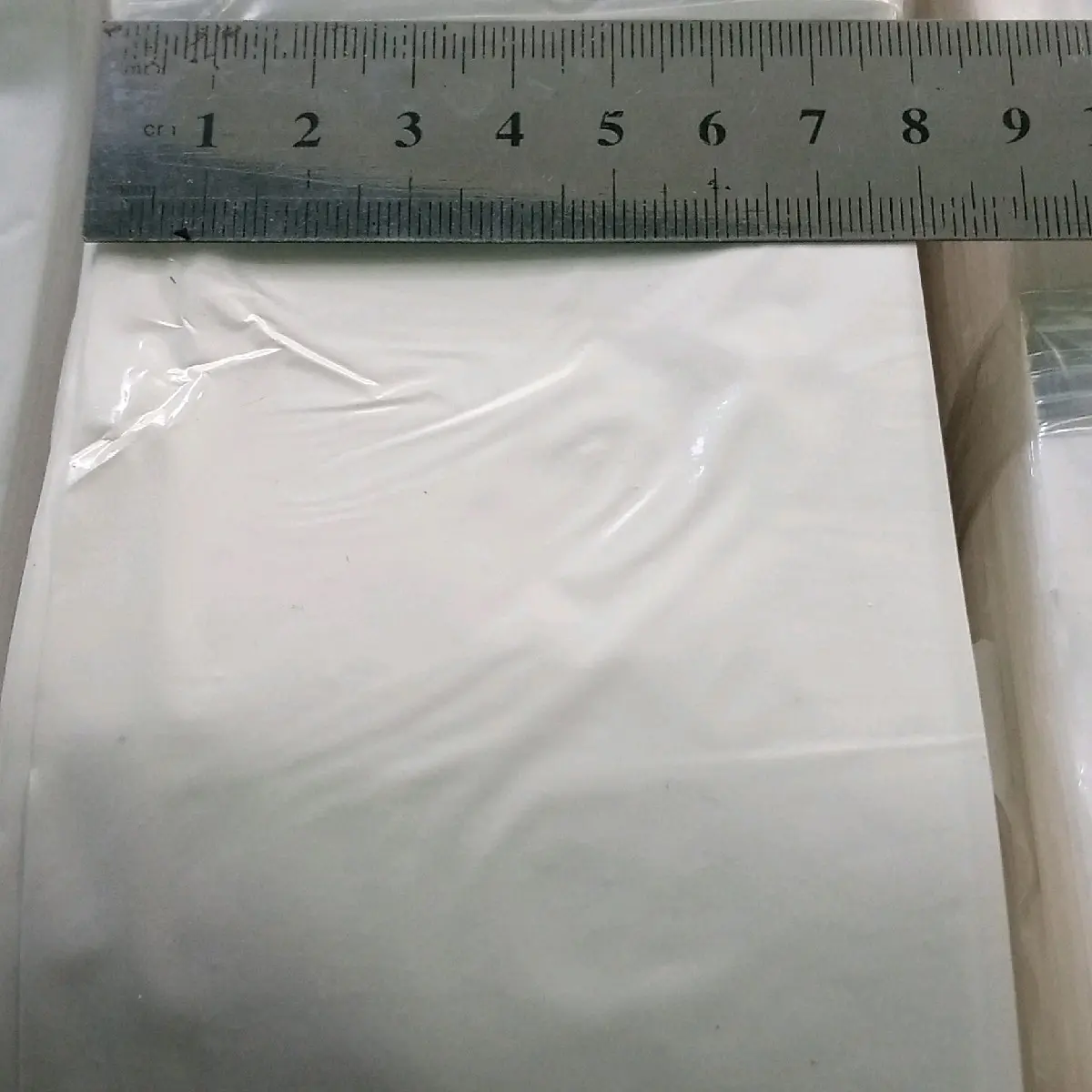 plastik roll dop tebal 03. (8x03x260m_putih susu)