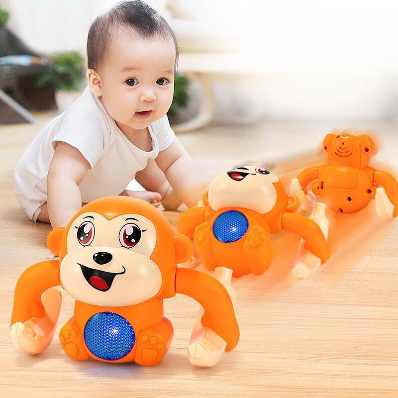 Đồ Chơi Khỉ Cầm Chuối Nhào Lộn 360 Độ Vui Nhộn Có Đèn Nhạc Cho Bé