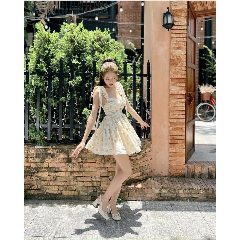 (Có BigSize) Set Đầm Hoa Vàng 2 Dây Cột Nơ Vai Đính Nút Ngọc Và Áo Khoác Thun Gân A3CV004