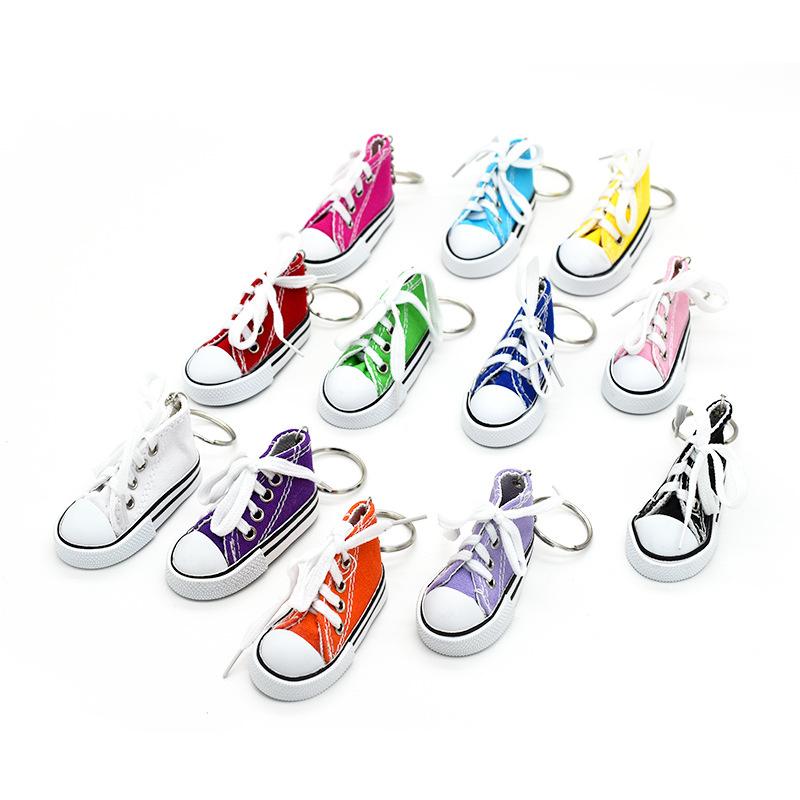 Product Introduction of Motorcycle Bicycle Foot Support Mini Cute Shoes Creative Car Keychains for Motorbike Bike Tripod Canvas Shoes Decor Cover 7