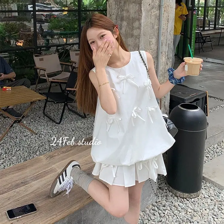 [SET55] Set áo ba lỗ kèm chân váy xếp li dáng ngắn đính nơ phong cách tiểu thư Hàn Quốc