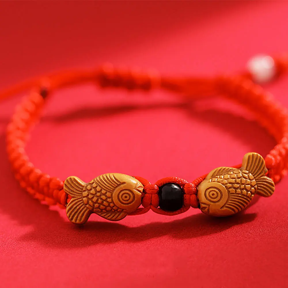 Vibrant colors Red String Wooden Fish Bracelet Intricate design Adjustable size Gift packaging Woven Wooden Fish Bracelet Handmade jewelry Woven