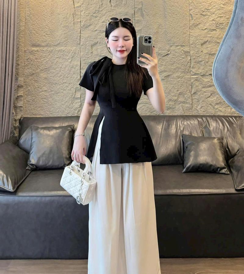 Product Introduction of Set đồ nữ áo tay ngắn cổ tròn buộc nơ xẻ tà mix quần xuông ống rộng dánh dài xinh xắn dành cho các nàng diện đi chơi đi tiệc. Nhung Ong Women Voi 13