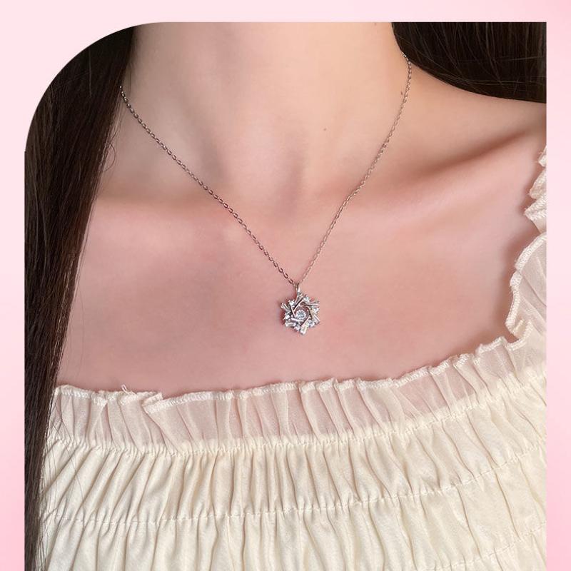 Product Introduction of Silver Titanium Steel Cross Chain Necklace with Winter Beating Heart Snowflake Pendant for Women Sweet Light Luxury Clavicle Chain 12
