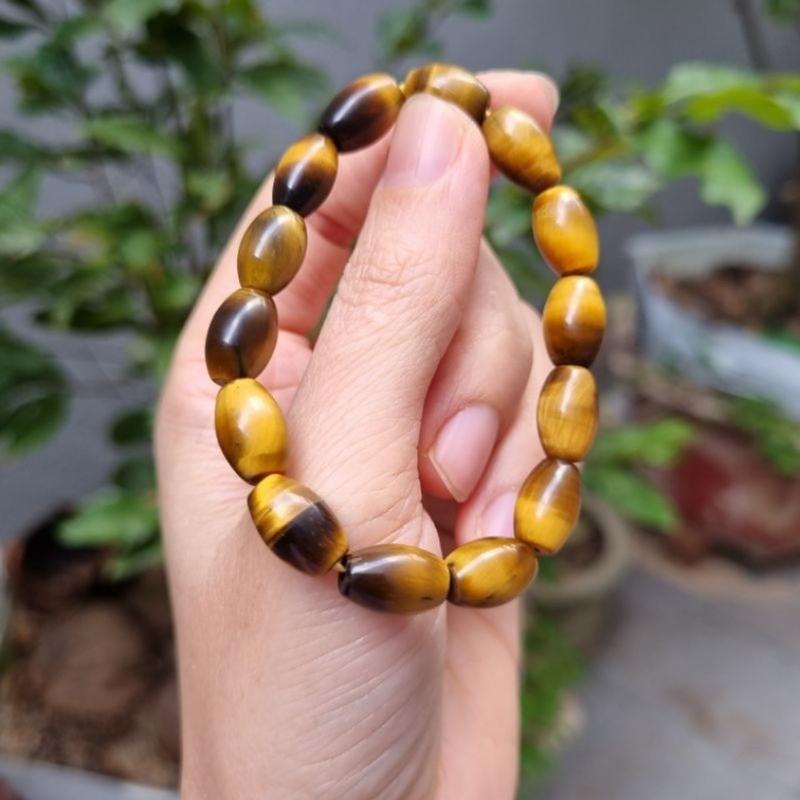 Vòng tay lu thống màu vàng nâu M.Hổ size 8 li 2
