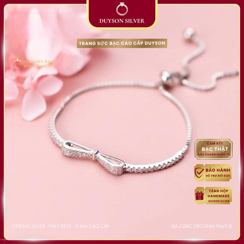 Lắc tay bạc Ý 925 mạ vàng trắng hình chiếc nơ kiểu dáng dây rút DUYSON SILVER, vòng tay nữ đính đá CZ 5A cao cấp [LTXK4]