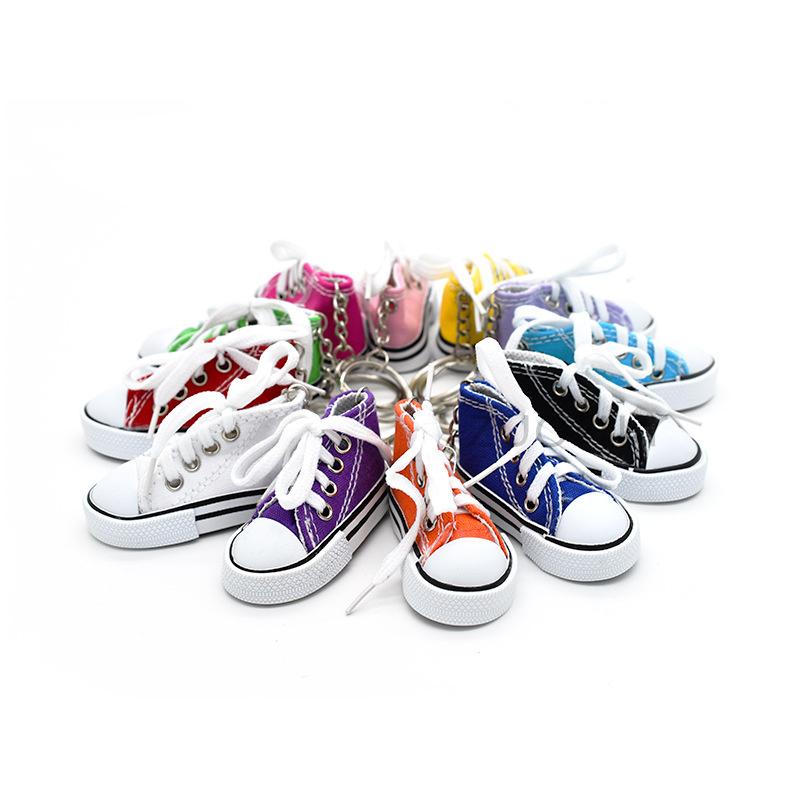Product Introduction of Motorcycle Bicycle Foot Support Mini Cute Shoes Creative Car Keychains for Motorbike Bike Tripod Canvas Shoes Decor Cover 8