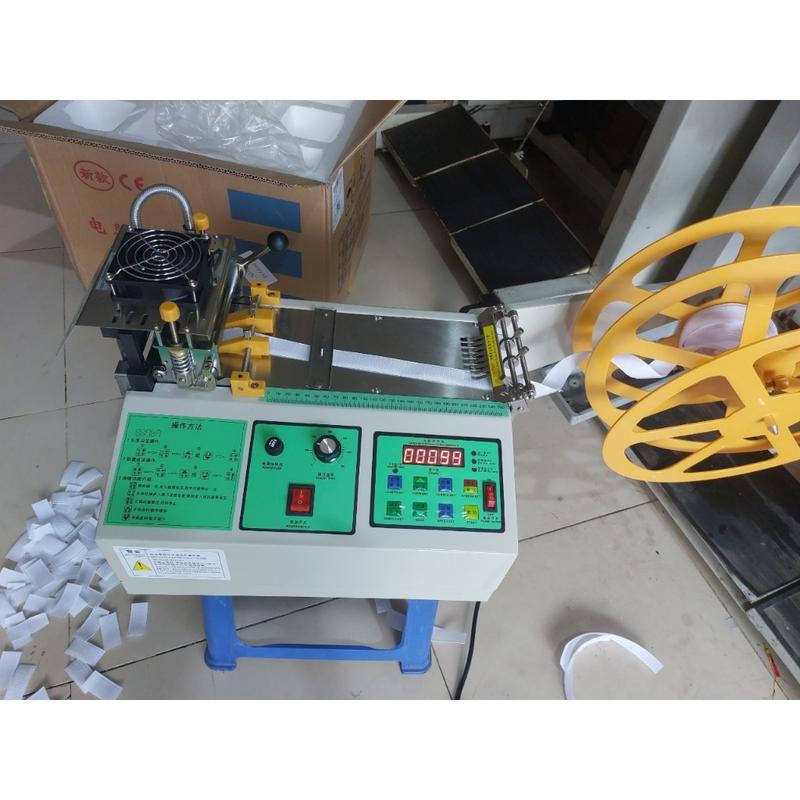 Máy cắt nhãn mác dây viền dây đai nhiệt tự động phụ kiện nghành may